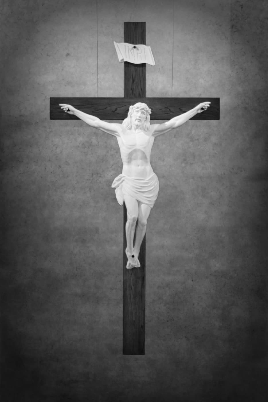 A stunning crucifix hung in Saint Margaret’s Bel Air (black and white).