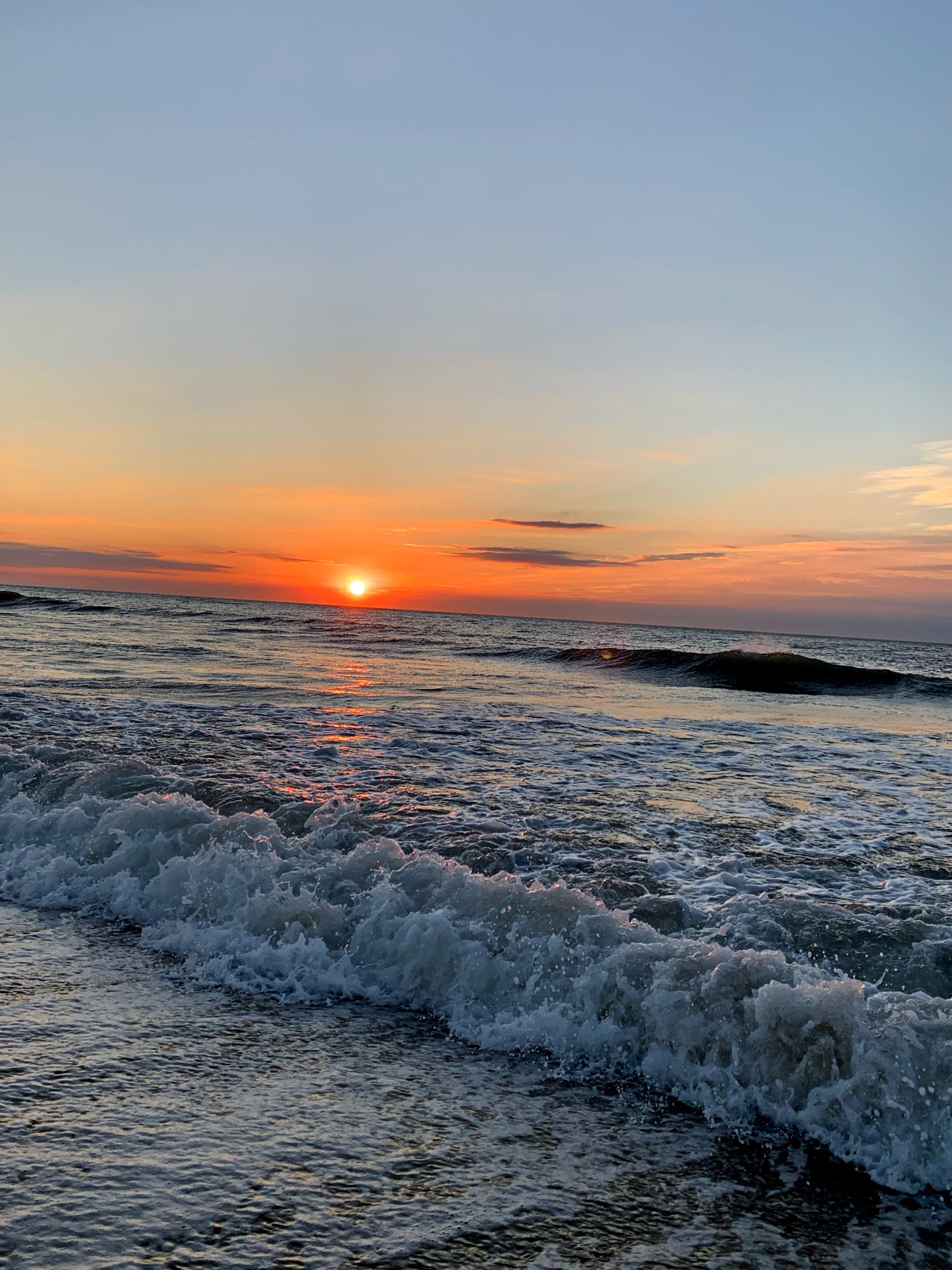 An OC sunrise captured as the waves were crashing along the beach.