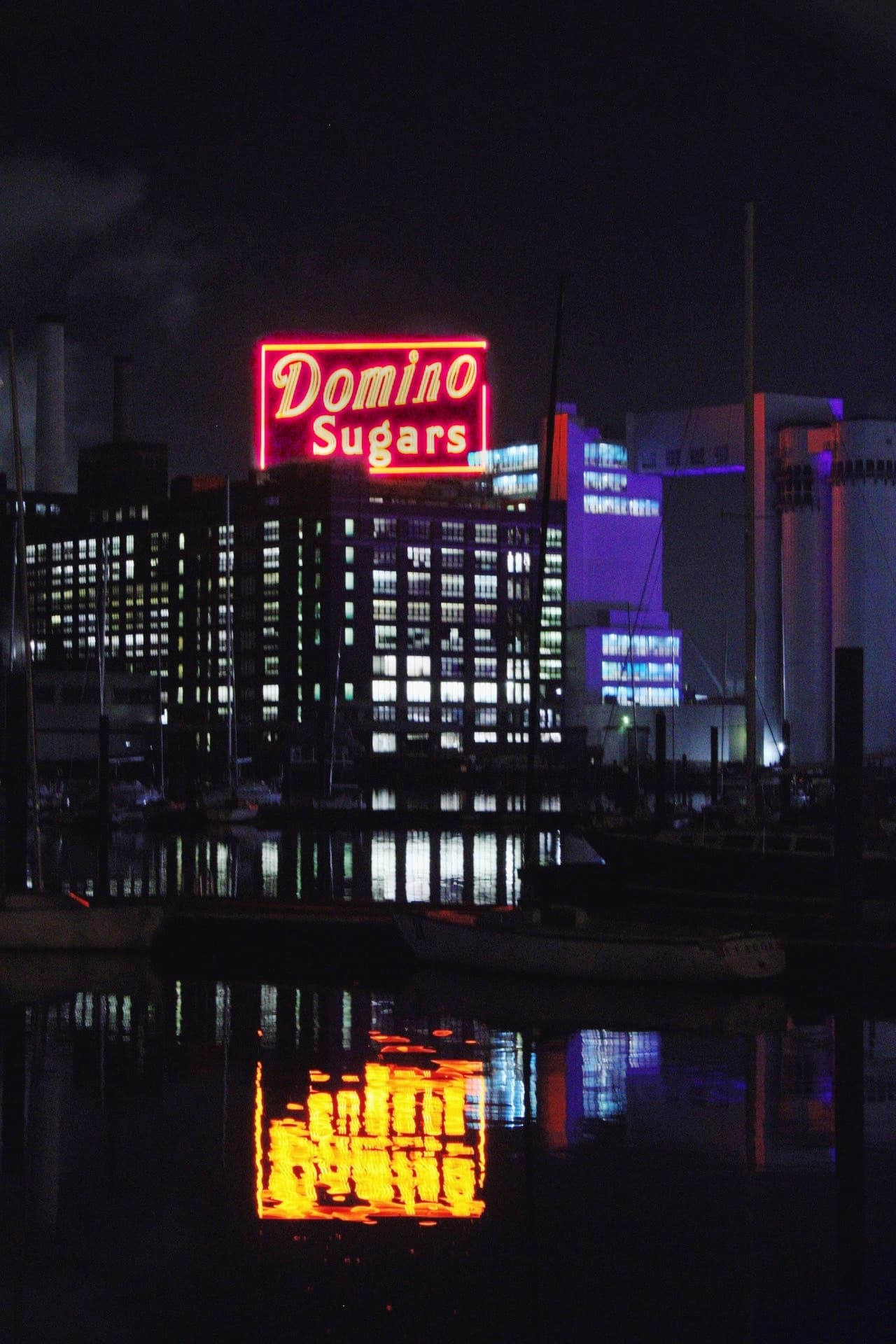 The iconic Domino Sugar sign in Baltimore city reflecting off the water to create a unique shot.