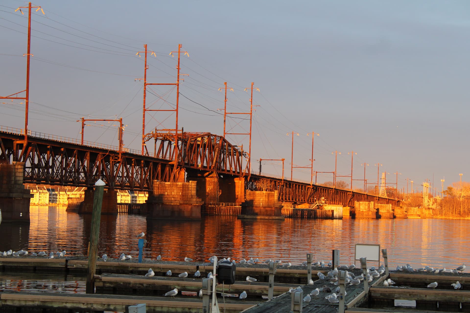 A golden sunset shining on the bridge in Havre de Grace.